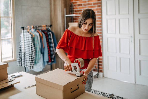 Woman working at home, selling items online